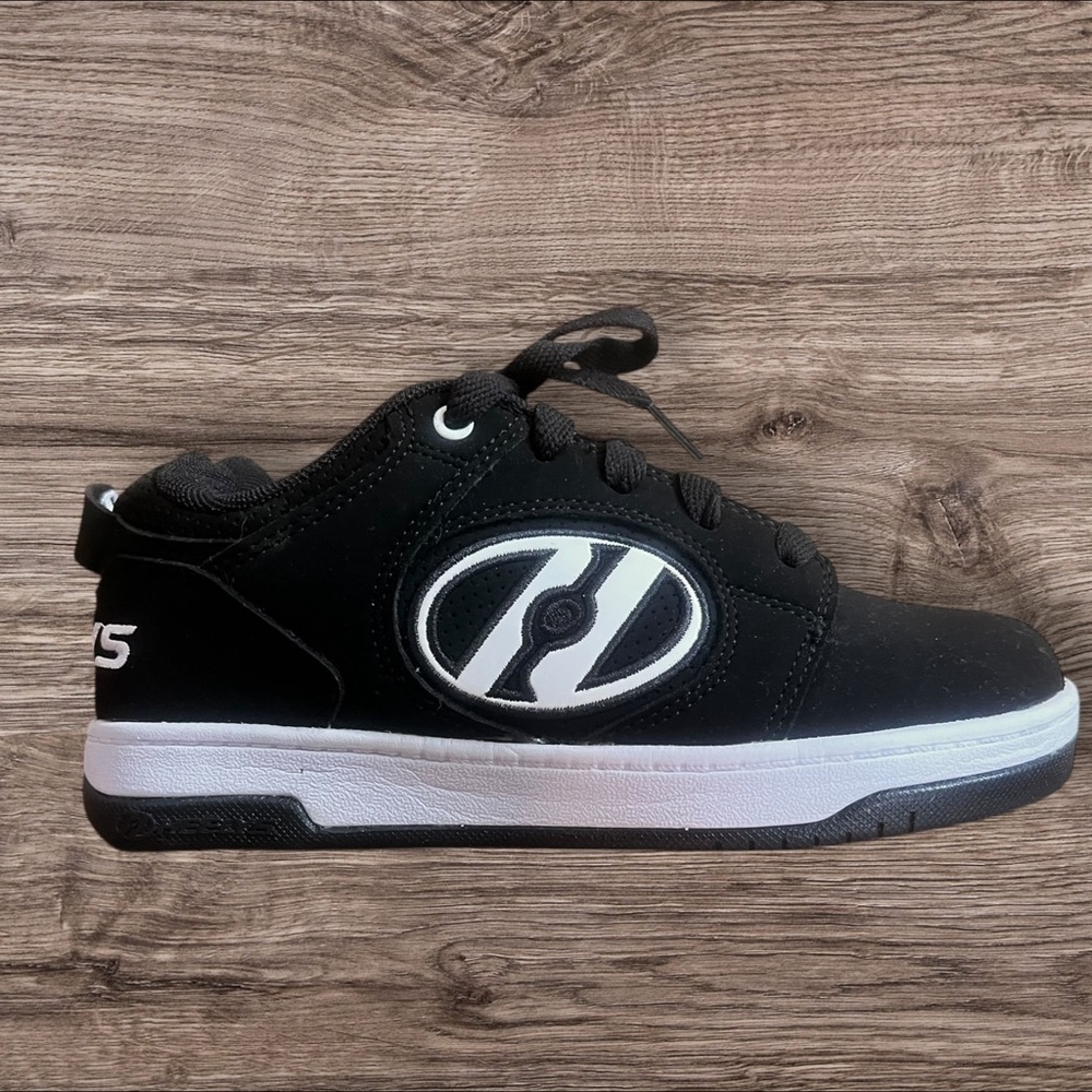 Heelys Black and White Roller Shoes.